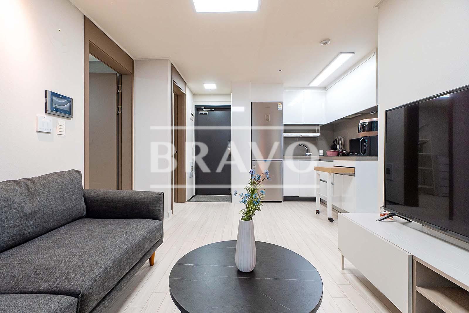 Living room with sofa and TV Short-Term Rent - Fully Furnished 2BR Apartment in Gangnam